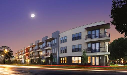 Modern apartment building exterior at twilight at Matilda at Lower Greenville Apartments, Dallas, TX 75206