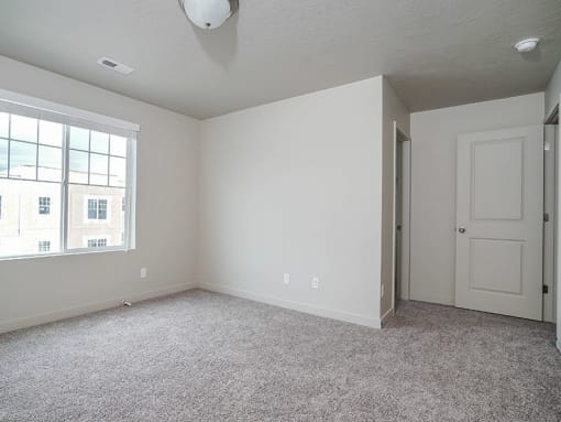 Room with window and closet at The Village at Church & Main, Layton,  84041