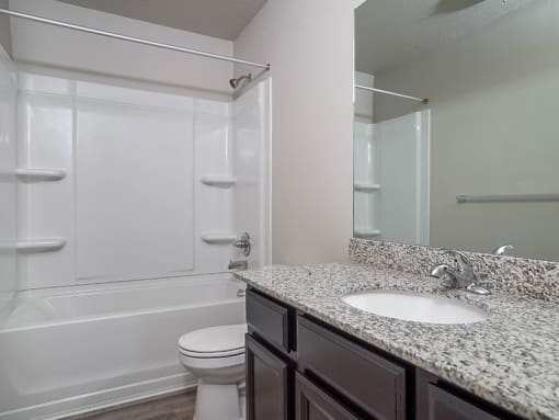 Bathroom with large mirror at The Village at Church & Main, Layton, UT