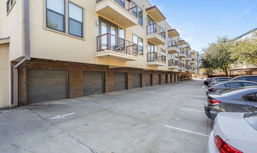 Ground level parking lot with private garage access at Matilda at Lower Greenville Apartments, Dallas, TX 75206
