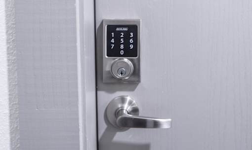 Electronic keypad entry lock with door handle at Avion at West Lemmon Apartments, Texas, 75235
