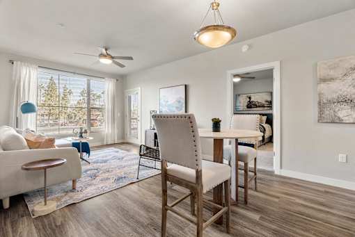 Living Room with Large Window at V on Broadway Apartments, Tempe, AZ