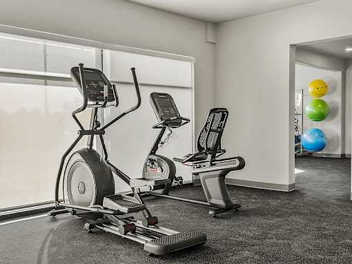 Gym with Stationary Bike at V on Broadway Apartments, Tempe