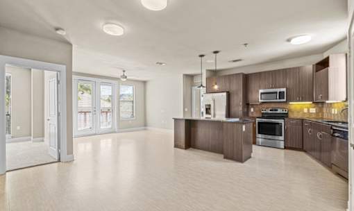 Open floor plan with modern kitchen and island at Matilda at Lower Greenville Apartments, Dallas