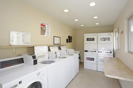 A laundry room with a washer and dryer in it.