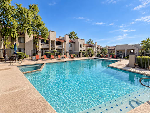 Resort style pool with lounge chairs and spa at Gentrys Walk Apartments, Mesa, AZ 85204
