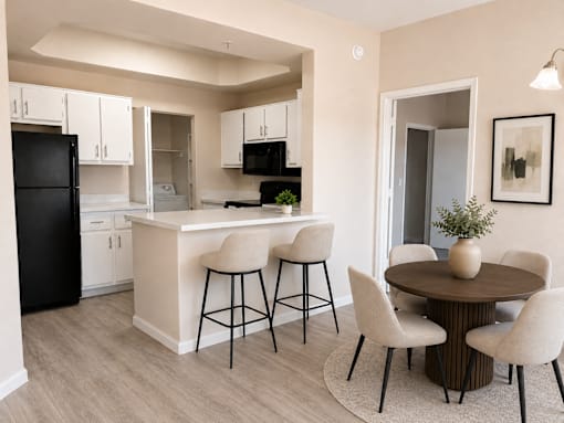 Kitchen and dining area with modern furnishings at Cortina Apartments, Phoenix, Arizona