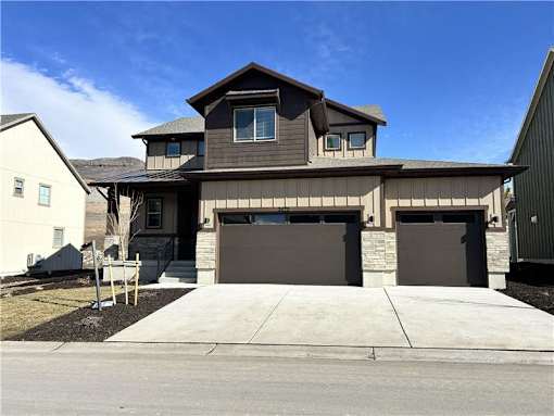 A modern house with a garage door.