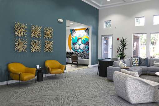 Rec room with couch and Tv and sitting chairs