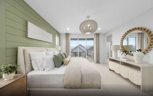 A bedroom with a large bed and a mirror on the wall.