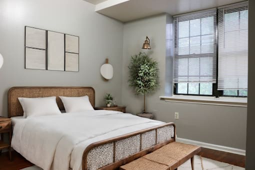 a bedroom with a large bed and a window