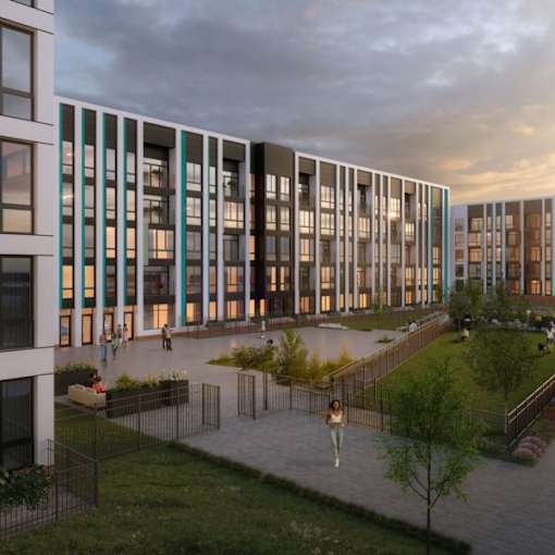 A modern building with a courtyard and people walking around.