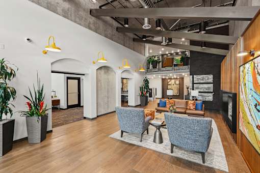 A modern office space with a wooden floor and a large mural on the wall.