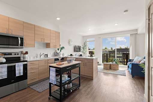 A modern kitchen with wooden cabinets and a large island.