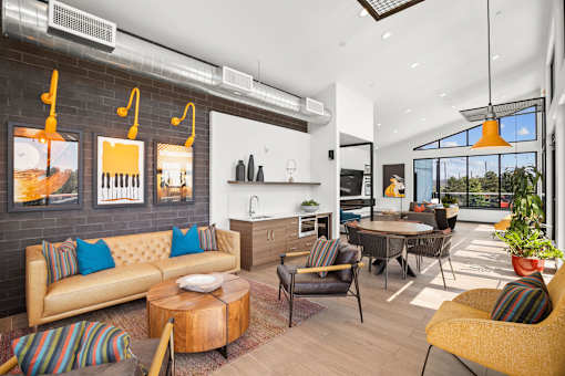A modern living room with a yellow sofa and a wooden coffee table.