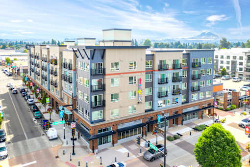 an aerial view of an apartment building on a city street