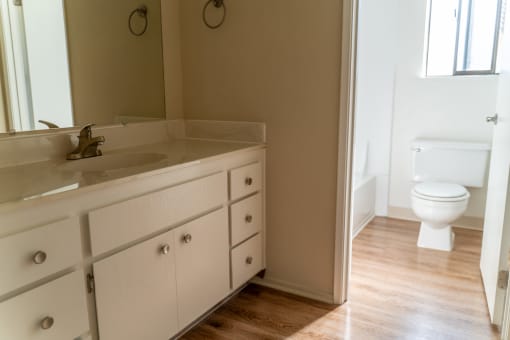 an empty bathroom with a sink and a toilet at Cowell Terrace Apartments, California, 94518