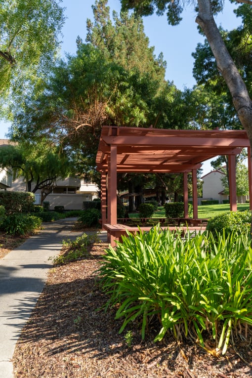 a pavilion in a park with plants and trees at Cowell Terrace Apartments, Concord, CA 94518