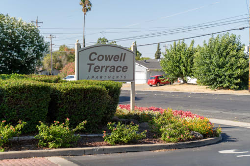 a sign for covenant terrace apartments on the side of a street at Cowell Terrace Apartments, California, 94518