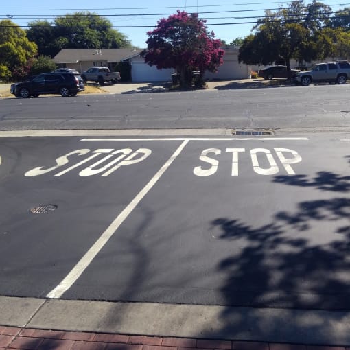 an empty street with a stop sign on it at Cowell Terrace Apartments, California