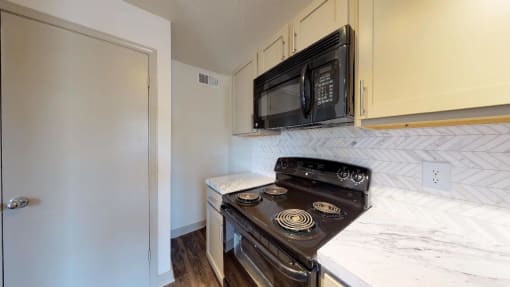 a kitchen with a stove and a microwave