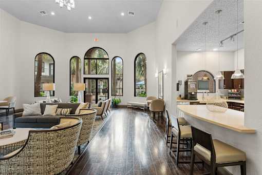 A well-lit, modern dining area with a long table and chairs.
