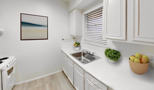 a kitchen with white cabinets and a sink