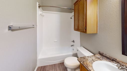 a bathroom with a sink toilet and a shower