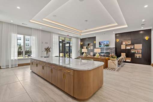 A reception area with a large counter and a TV mounted on the wall.
