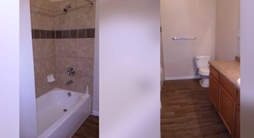 A bathroom with a tub and toilet.