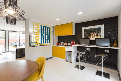 a kitchen and dining room with a table and chairs