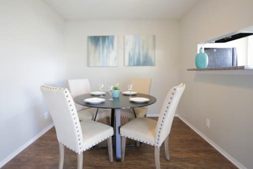 Dining area with table and four chairs