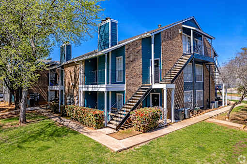 A large house with a staircase leading to the second floor.