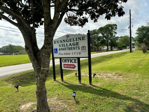 a sign that reads evangeline village apartments