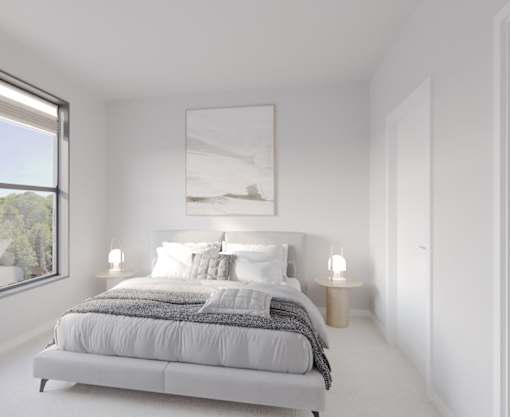 A bedroom with a large bed and a painting on the wall. at Enclave on Ross Apartments, Texas