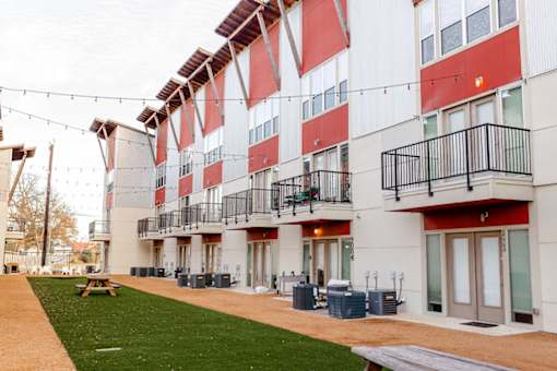 A modern building with red and white stripes.