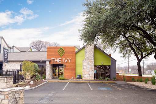 The Ivy is a restaurant with a green and orange exterior.