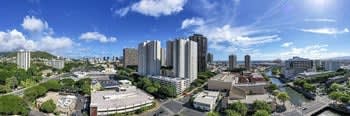 a city with many tall buildings and trees
