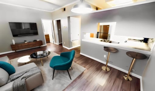 a living room and kitchen with a couch and a chair