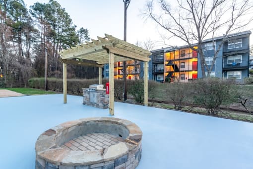 Patio with fireplace and grill at Triangle Park Apartments, Durham, 27713