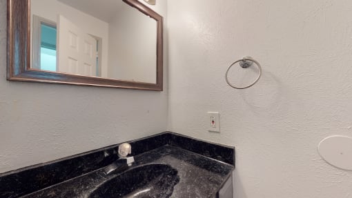 a bathroom with a sink and a mirror