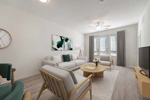A living room with a sofa set, a coffee table, and a television.