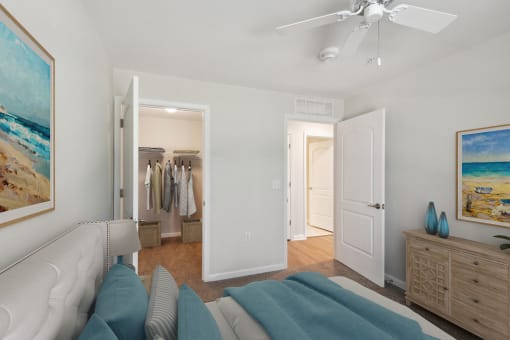 a living room with a couch and a ceiling fan