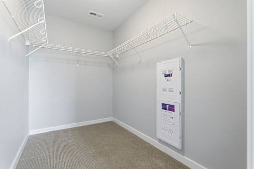 A white wall with a white box on it.