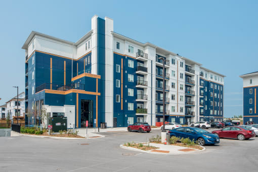 a building with cars parked in front of it