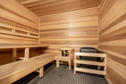 a sauna with a bench and table