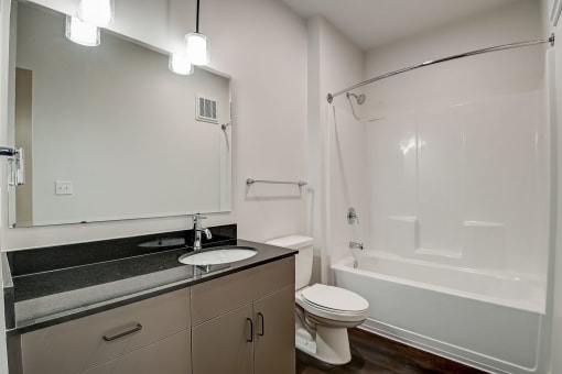 a bathroom with a sink toilet and bathtub