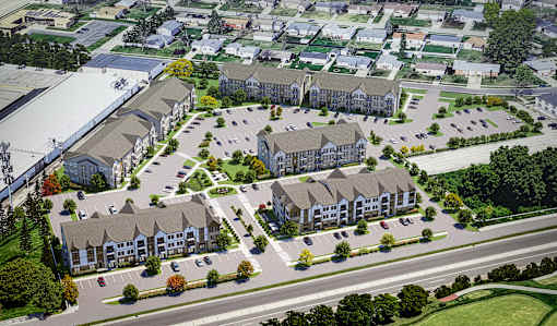 A large apartment complex with multiple buildings and parking lots.