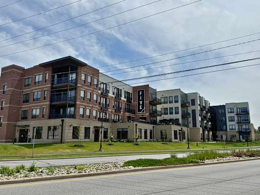 A large apartment complex with multiple buildings and balconies.