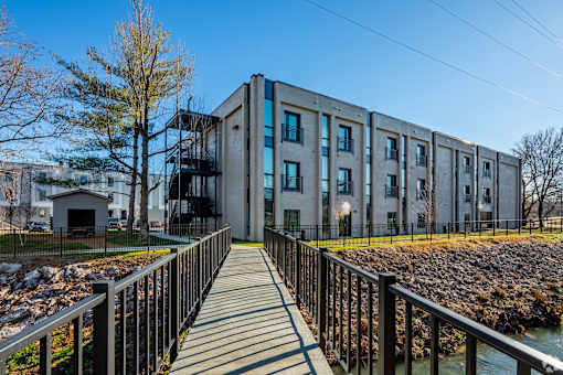 a large building with a bridge in front of it